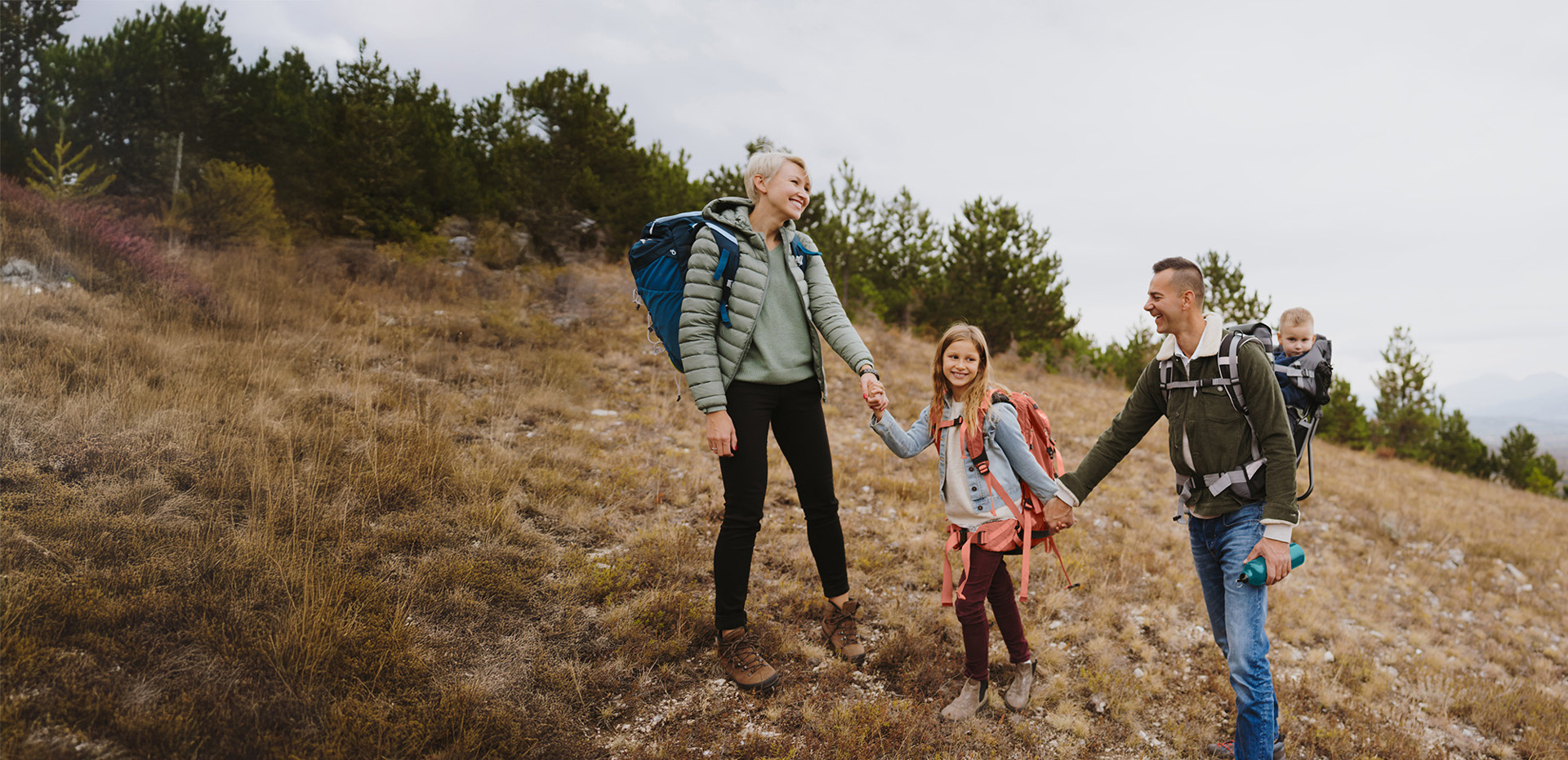 Family with young children hiking
